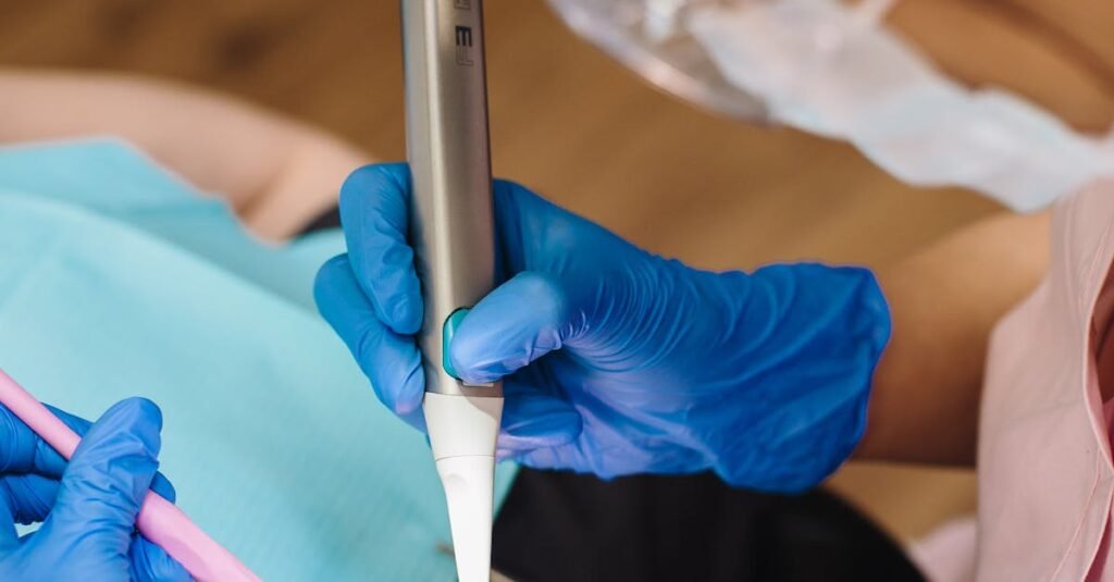 Services A dentist performs a procedure using modern dental equipment on a patient wearing protective glasses.